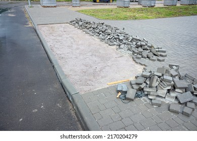 Construction of an accessibility ramp for wheelchair, bicycles, prams on the sidewalk near the house