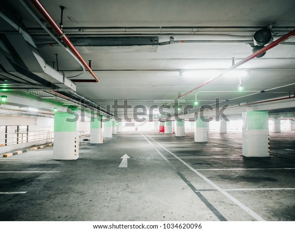 construction for automatic technology check for
empty area of car parking lane in shopping mall with red fire
extinguisher no the
wall