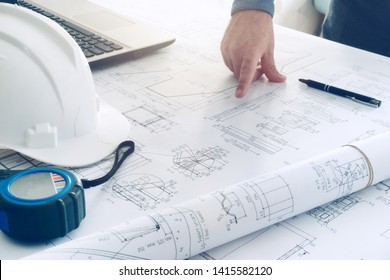 construction blueprints engineering man hard white helmet work table