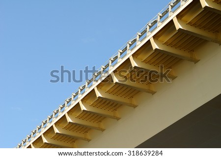 The construction bridge span on background of blue sky