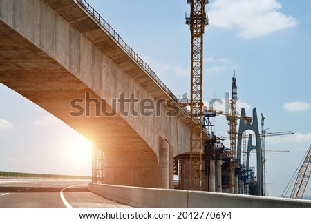 Construction of bridge under blue sky.