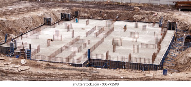 Construction of the building. Construction of an apartment house. Concrete slab foundation building. The foundation of reinforced concrete multistory apartment building. 