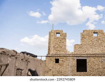 Construction of a building in Asia using bricks of various colors