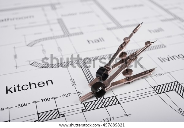 Construction of the\
building layout, building drawing on paper, a set of compasses for\
drawing of steel.