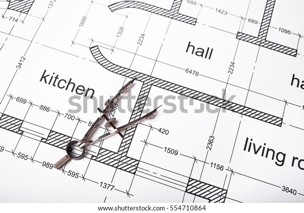 Construction of the building layout, building\
drawing on paper, steel compasses for\
drawing