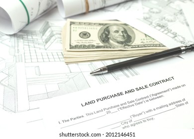 Construction of a building on a new plot of land according to architectural drawings, office desk background photo