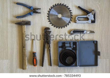 Construction, building and repair tools set for house work on wooden  background. Top view.