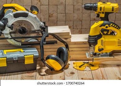 construction carpentry electric hand tools on wooden background - Shutterstock ID 1700740264