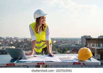 Construction concept of engineer or architect woman working at construction site. - Shutterstock ID 2227013541
