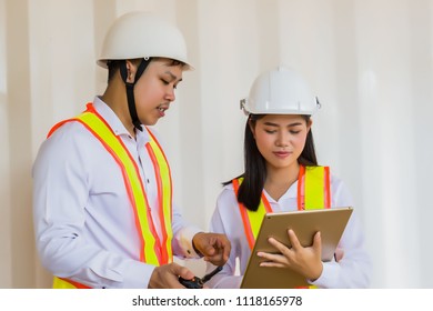 Construction concepts, Engineer and Architect working at Construction Site with blueprint. Construction inspector, work site