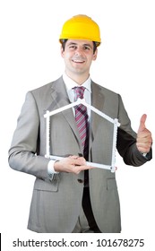 Construction Contractor Businessman Holding A Wooden Yard Stick Shaped Like A Symbolic House, And Showing Thumb Up. Isolated On White Background.