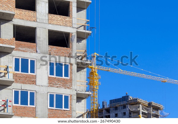 Construction crane and a\
building house 