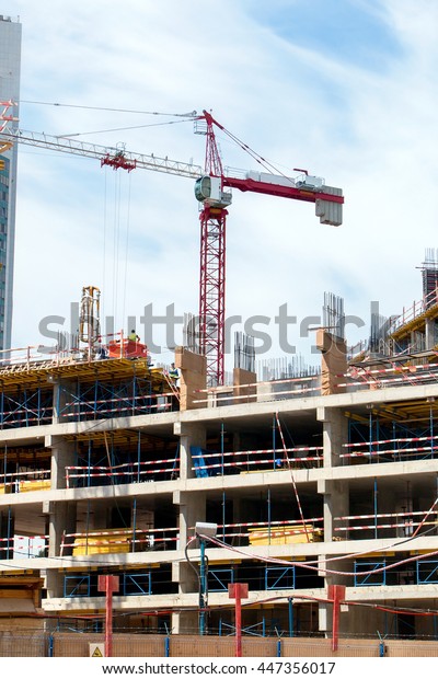 construction crane\
building a house and\
skyscraper