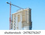 Construction Crane at Building Site - Concept of Modern Construction