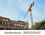 Construction crane constructing a building in the city