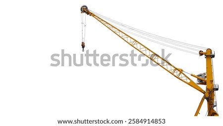 Construction crane isolated on white background. Yellow industrial crane with a long arm, ready for operation. Copy space