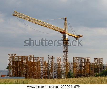 Construction crane with parts to other cranes prepared for selling. 