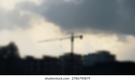 A construction crane silhouetted against a dramatic, cloudy sky at dusk, representing industry and building. The image captures the essence of construction and the environment.