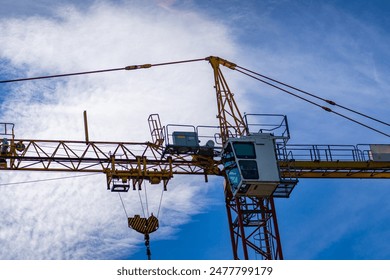 Construction Crane With White Cab Against Blue Sky - Powered by Shutterstock