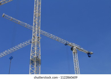 Construction Cranes Working On The One Of The Many Building Sites Around The Grand Canal Quay Area Of Dublin.