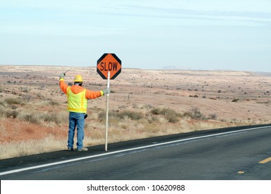 Construction crew man controlling traffic