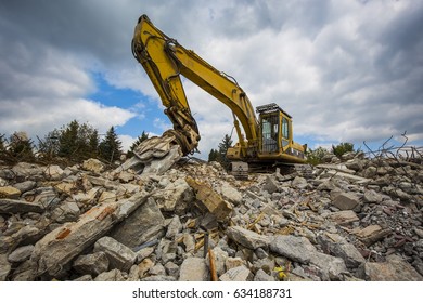 Construction Debris With Grabber Machine