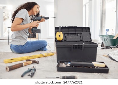 Construction, drill and wall with DIY woman in home for decoration, maintenance or repairs. Design, power tools and project management with person in apartment for building, improvement or remodel - Powered by Shutterstock