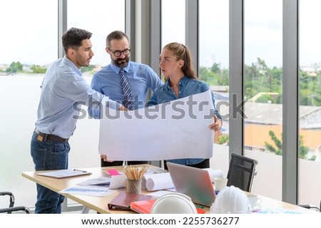 Construction engineer and architect check plan working with the blueprint on office worker conference site. Engineers team meeting for architectural project. Construction Concept