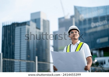 Construction engineer or foreman working on construction site. Plan and execute building construction and design.