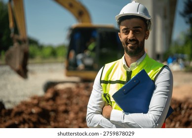 A construction engineer hard hat safety vest clipboard excavator site outdoor male confident, professional portrait with clipboard near excavator on site, confident, outdoor engineer at work