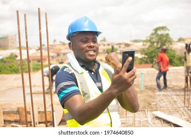 A Construction Engineer Looking At His Phone