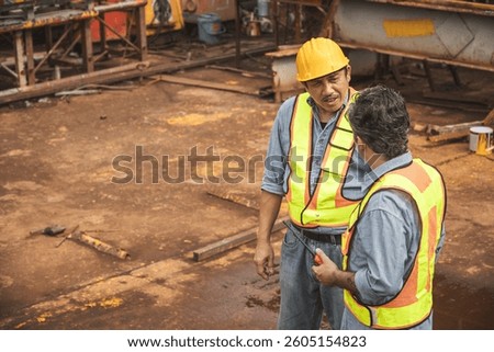 Construction engineer team working together join teamwork talking together at construction site