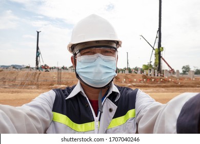 A Construction Engineer Wearing PPE And Face Mask Protect Corona Virus Or Covid19 Working At Construction Site