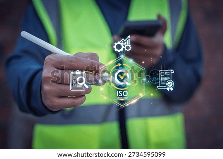 Construction engineer worker using digital stylus pen on smartphone with virtual ISO quality control certification interface icons, Approval Verification Management, Quality assurance, Digital audit