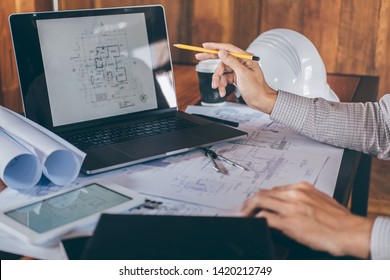 Construction Engineering Or Architect Hands Working On Blueprint Inspection In Workplace, While Checking Information Drawing And Sketching For Architecture Project Working.