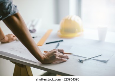 Construction Engineering. Close Up Of Engineers Hands Working On Table