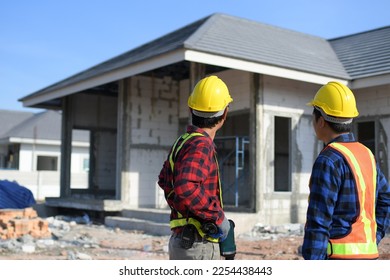 construction engineers and construction teams order work on site. - Shutterstock ID 2254438443