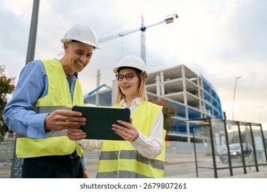 Construction engineers working together using digital tablet