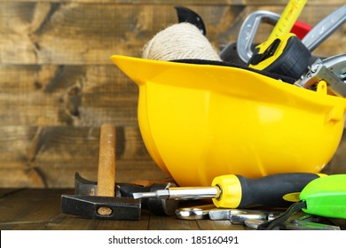 Construction Equipment On Wooden Background