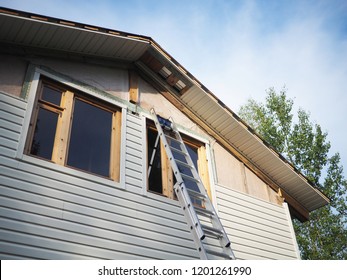 Construction Of The Frame House. Siding Installation