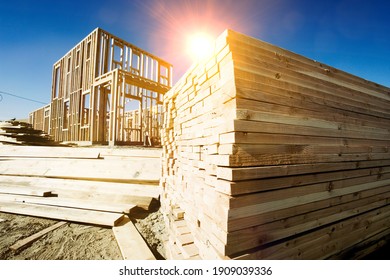 Construction Frame Of A House With Yellow Lens Flare