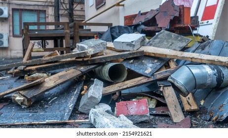 Construction garbage is piled up at site after building repair  Trash heap  Pile home rubbish thrown after renovation  Waste   timber dumped  Cleaning   sorting garbage after demolition jobs 