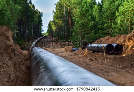 Construction Gas Pipeline Project. Natural Gas and Crude oil  Transmission in pipe to LNG plant (shipped by LPG tanker). Building of transit petrochemical pipe in forest area. Pipes Welding
