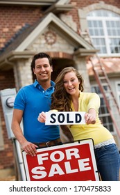 Construction: Happy Couple Buying New Home.