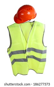Construction hard hat and high visibility vest on a white background