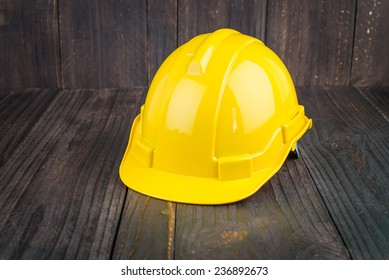 Construction Hard Hat On Wooden Background