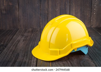 Construction Hard Hat On Wooden Background