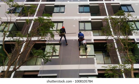 Construction Mechanic Repair Of High Building By Using The Abseiling Rope.