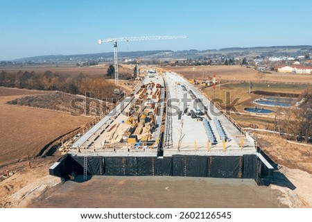 Construction of Highway D35, including the installation of a new concrete bridge.