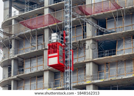 Construction hoists elevator for workers and material at the construction site.